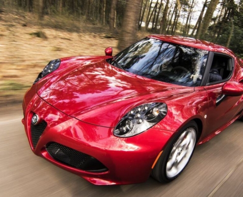 red car speeding on the road - plug-in-performance-chip