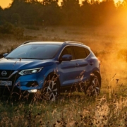 Nissan SUV during sunset in a meadow - plug-in-performance-chip