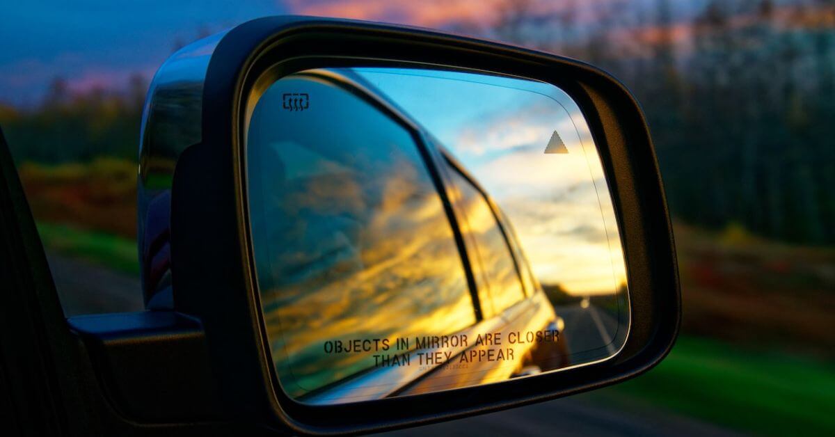 selective-focus-photography-of-vehicle-side-mirror-rocket-chip-plug-in-performance-chip