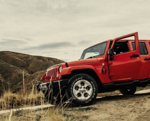 red-jeep-wrangler-going-down-a-dirt-hill-rocket-chip-plug-in-performance-chip