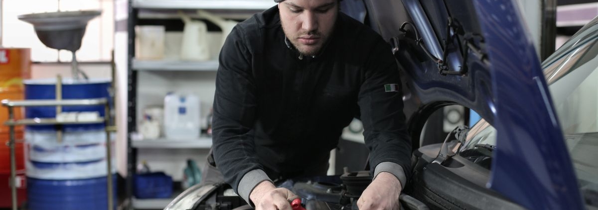 person performing car maintenance - rocket car maintenance