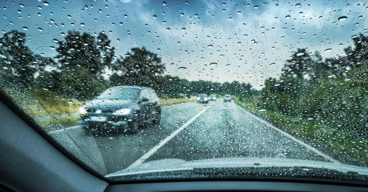 person driving during a rain storm - rocket chip getting your vehicle autumn ready