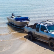 silver truck dropping boat into lake - rocket chip towing power