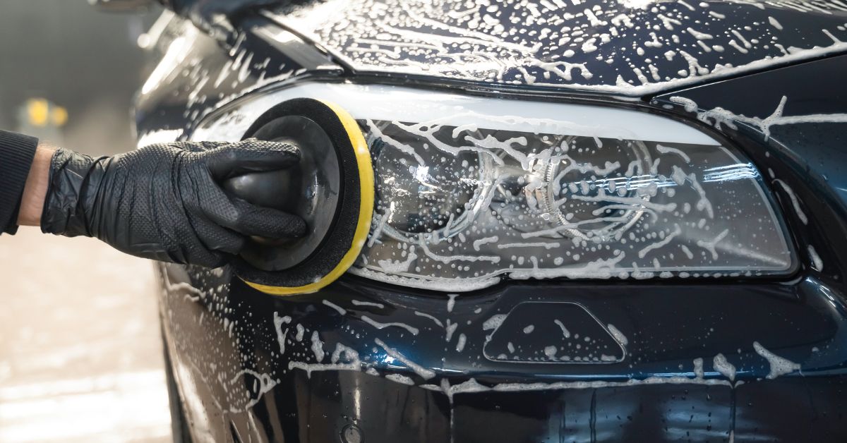 person washing car headlights - rocket chip winter preparation for your vehicle