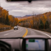 /car-riding-on-highway-through-autumn-forest - rocket chip - performance-chips-for-fall