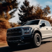 white Ford truck driving on a country road - rocket chip performance chips