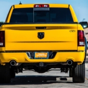 yellow dodge truck driving on a road - rocket chip plug in performance chips