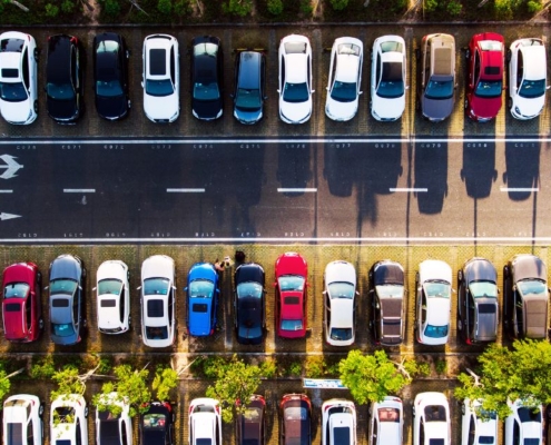 line of vehicles in a parking lot - rocket chip plug in performance chips