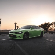 green Dodge car sitting in an empty desert parking lot - rocket chip Dodge Performance Chip