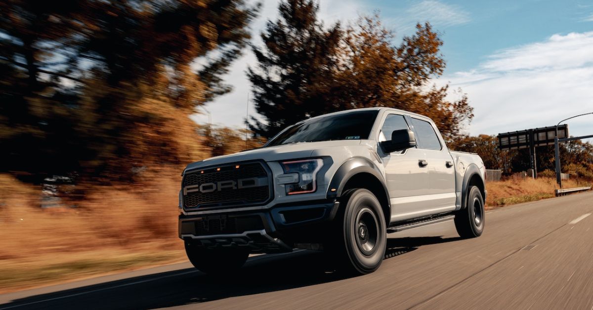 Grey Ford truck driving down a road - Rocket Chip plug in performance chip