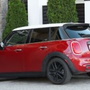 red Mini Cooper parked by bushes - rocket chip Mini Cooper performance chips