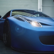 blue sports car parked in a garage with headlights turned on - rocket chip plug in performance chip
