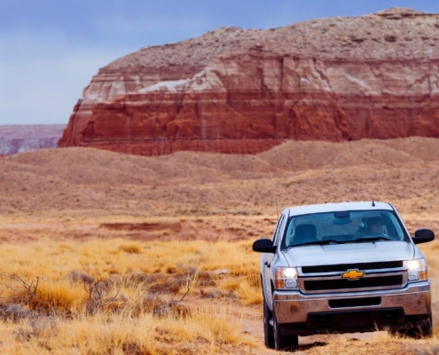 beige Chevy SUV driving through desert - rocket chip AFM Disablers