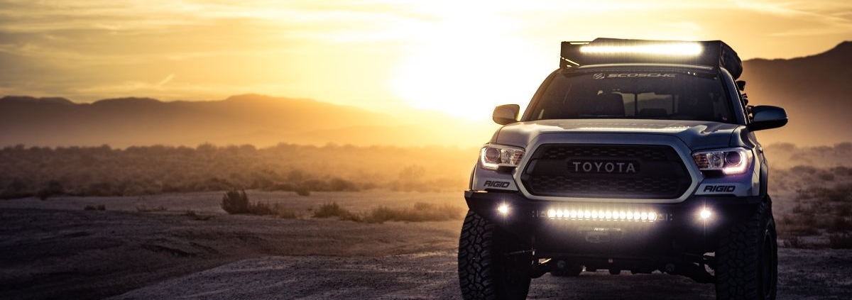 Grey Toyota Tacoma truck driving at sunset - rocket chip Toyota Tacoma Performance Chip