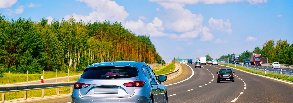 multiple vehicles driving on a curved road - rocket chip plug in Performance Chips