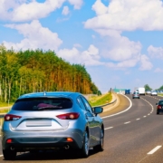 multiple vehicles driving on a curved road - rocket chip plug in Performance Chips