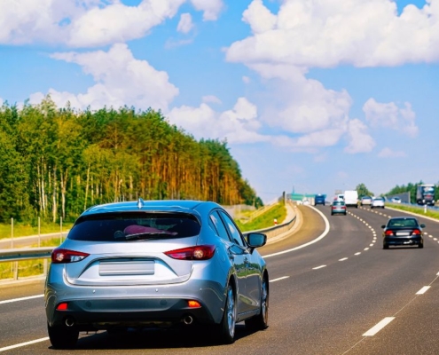 multiple vehicles driving on a curved road - rocket chip plug in Performance Chips