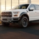 white Ford F150 parked near a fence - rocket chip install a performance chip