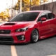 red Subaru hatchback parked in a lot - rocket chip Subaru performance chips