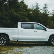 white Chevy Silverado truck parked by trees - rocket chip AFM Disabler