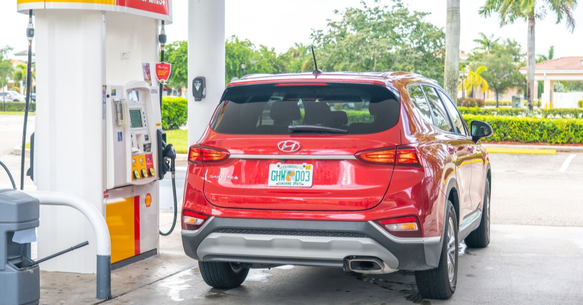trunk view of a red Hyundai SUV getting gas - rocket chip Hyundai Performance Chip