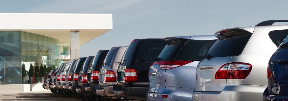 row of brand new vehicles parked at a dealership - rocket chip performance chip