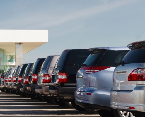 row of brand new vehicles parked at a dealership - rocket chip performance chip