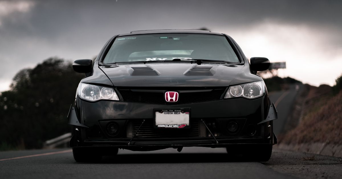 black Honda sedan with a red enblem - rocket chip plug in performance chip