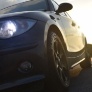 front of black car with LED headlights - rocket chip plug in performance chip