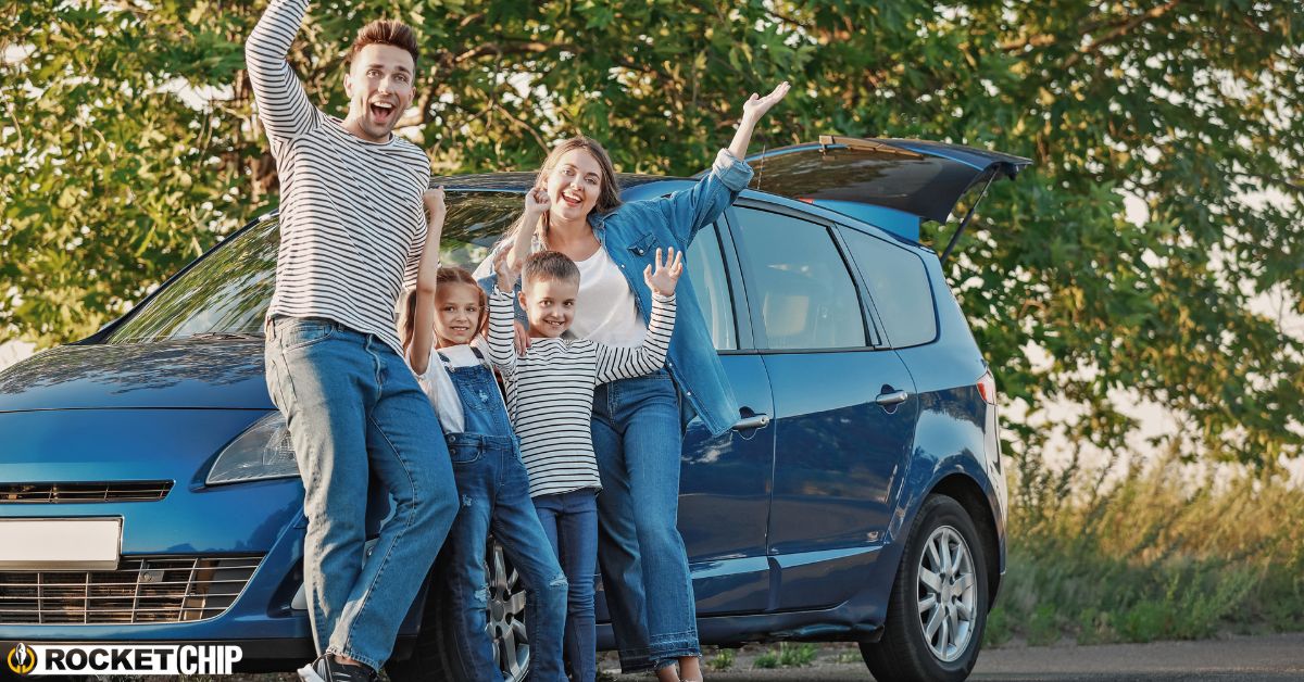 family of four by their blue vehicle - rocket chip plug in performance chip