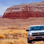 Chevy truck driving through rocks in the dessert - rocket chip Chevy performance chip