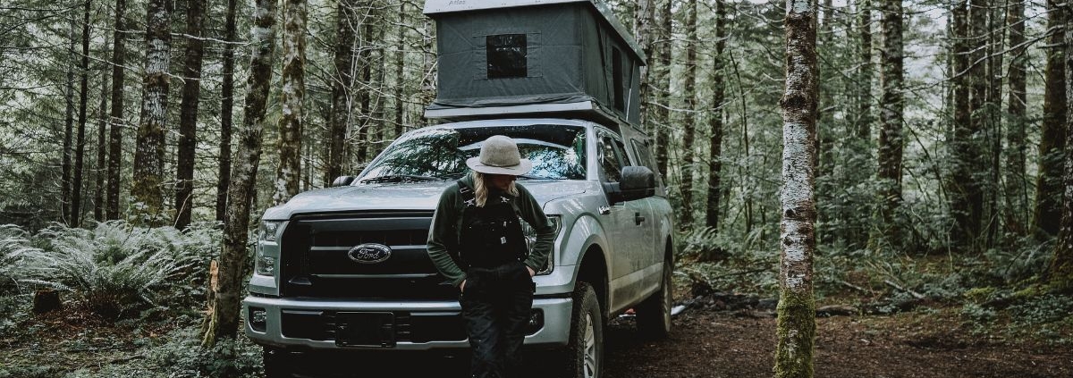 person standing next to a white Ford truck - rocket chip Ford performance chip