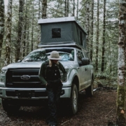 person standing next to a white Ford truck - rocket chip Ford performance chip
