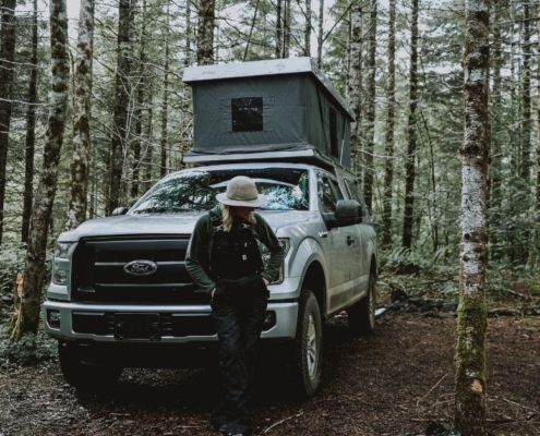 person standing next to a white Ford truck - rocket chip Ford performance chip
