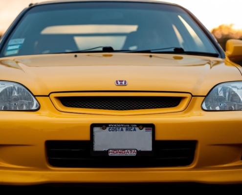 front view of yellow Honda car - rocket chip Honda performance chip
