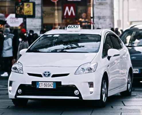 front end of a white Toyota Prius - rocket chip improving MPG