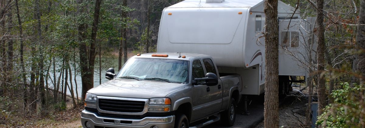 truck hauling a camper through the woods - rocket chip increasing power for towing