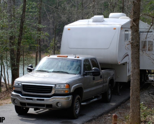 truck hauling a camper through the woods - rocket chip increasing power for towing