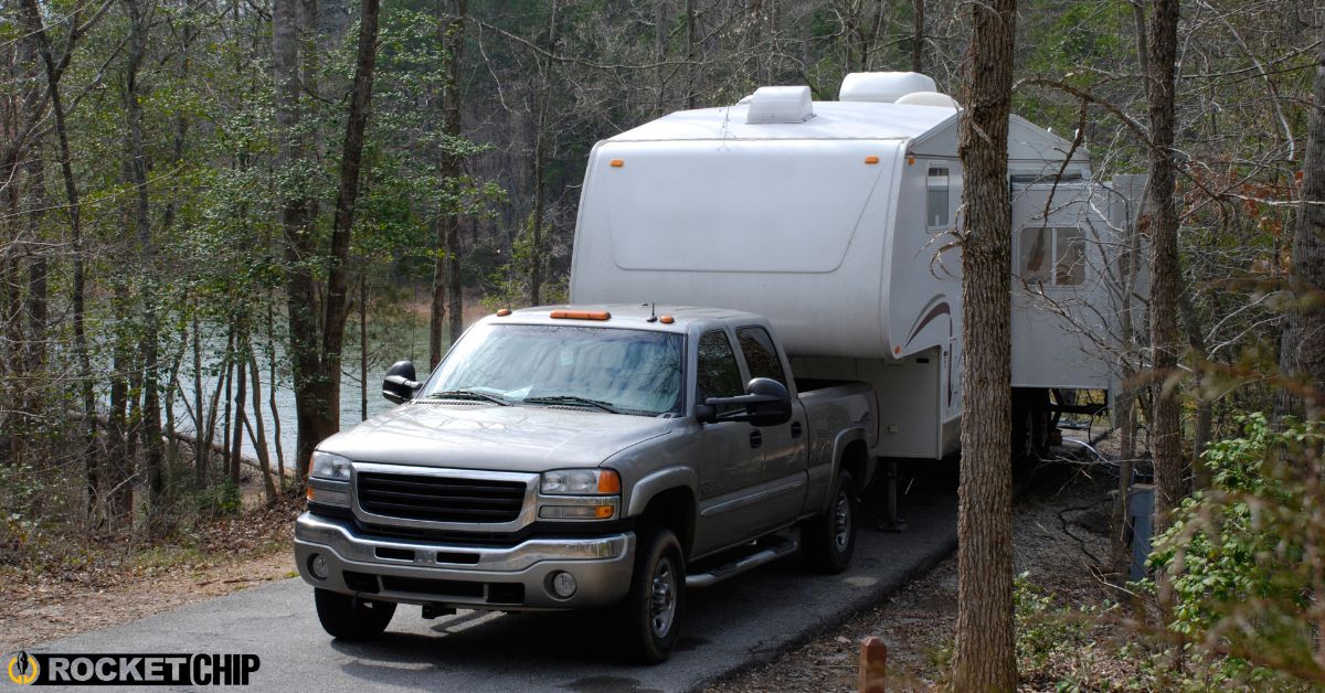 truck hauling a camper through the woods - rocket chip increasing power for towing
