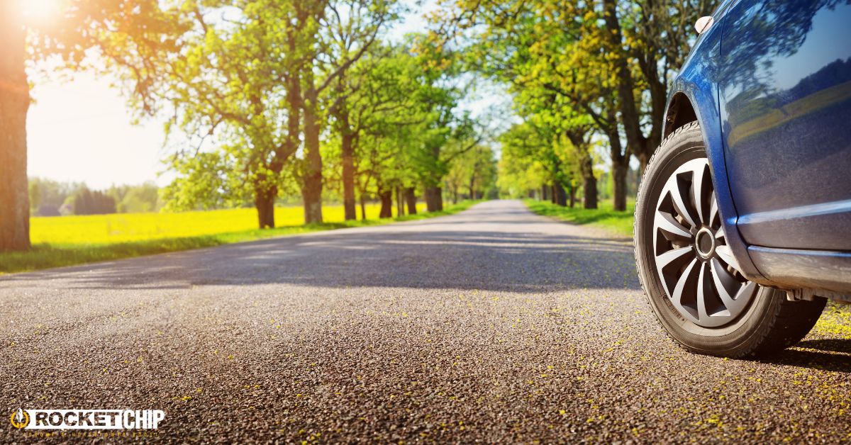 close up of vehicle wheel in the summertime - rocket chip improving MPG