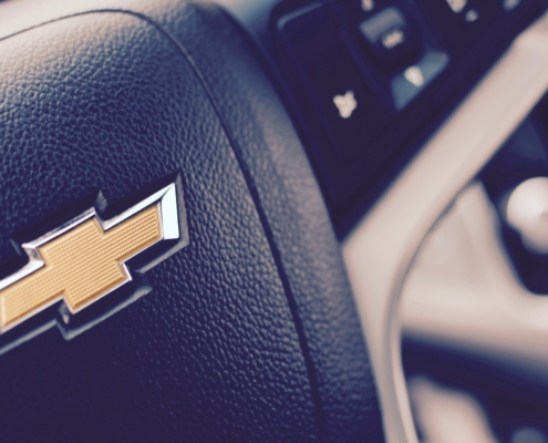 close up of a steering wheel with a Chevy logo - rocket chip AFM Disabler