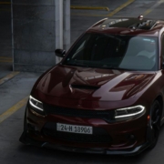 Maroon colored Dodge car driving down a road - rocket chip Dodge Performance Chips