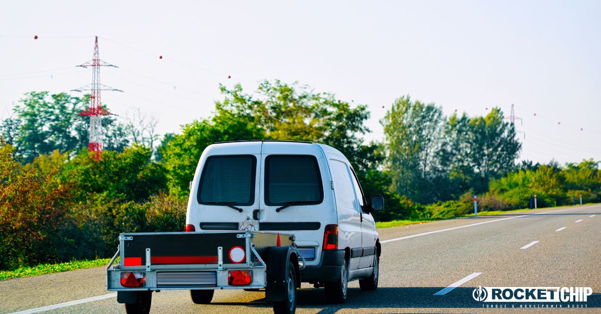van with a metal trailer attached - rocket chip Increasing Power for Towing