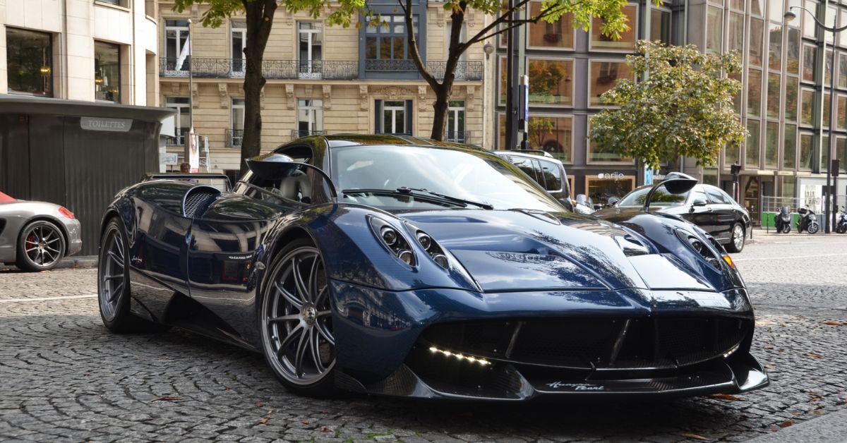 front view of a dark blue sports car parked on a city street - Rocket Chip performance chip